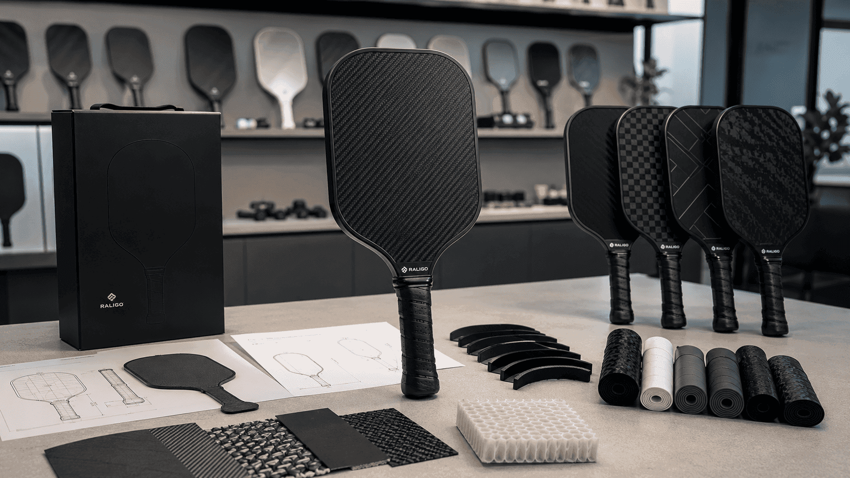 Custom pickleball paddle design-to-production workflow with CAD concept, carbon fiber samples, and finished OEM paddles