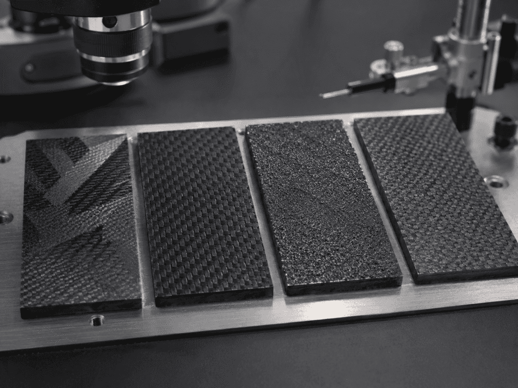 Comparison of UV clear coat, peel-ply, spray grit, and hybrid nano-texture paddle surface treatments