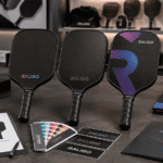 Three carbon fiber pickleball paddles showing OEM logo customization with pad printing, laser etching, and in-mold graphics