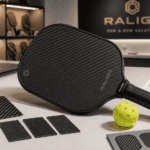 Carbon fiber pickleball paddle with engineered surface texture displayed for USAPA-compliant spin performance development